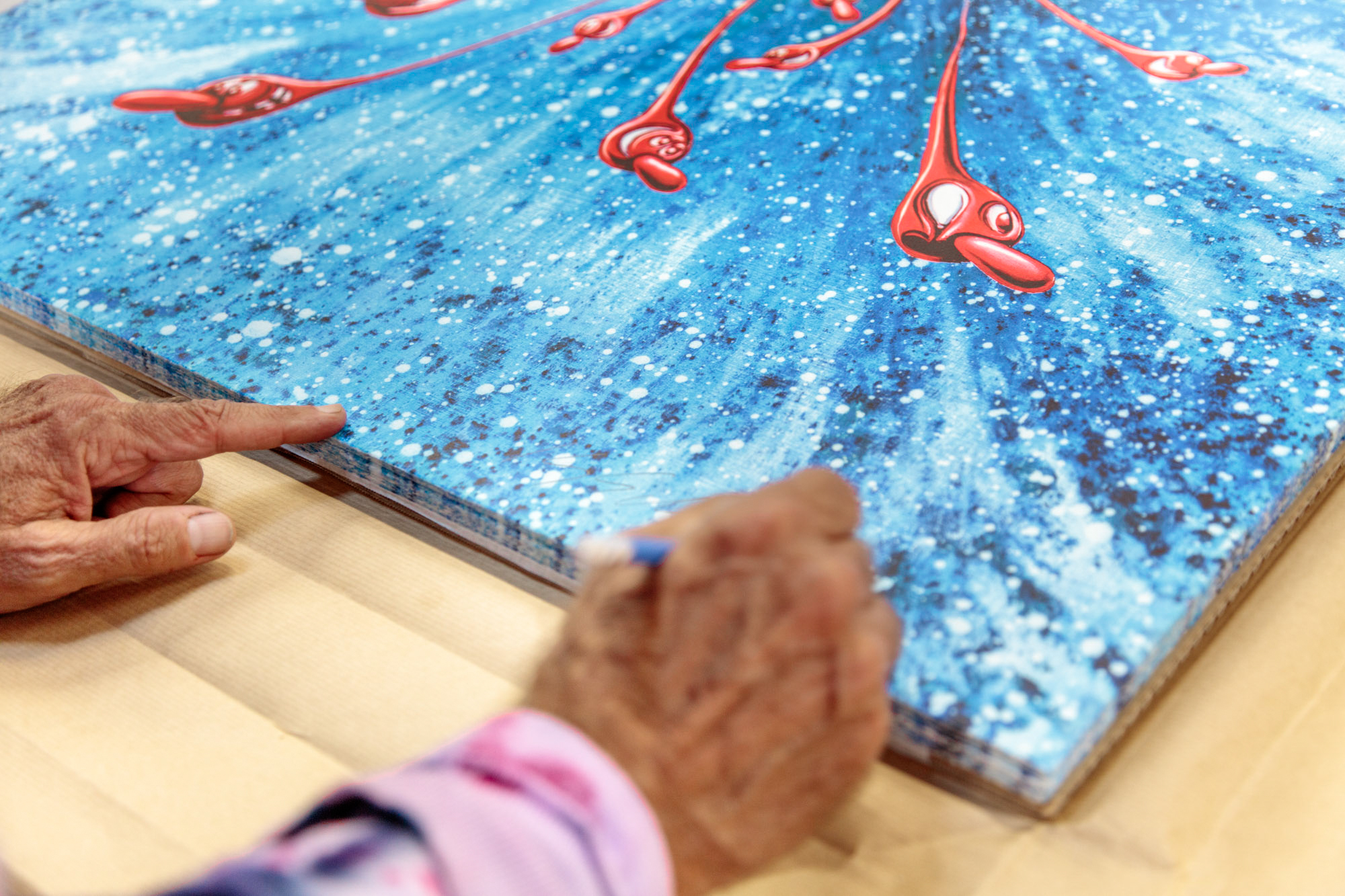 in-the-beginning-red-gloss-edition-kenny-scharf-jrp-signature-detail